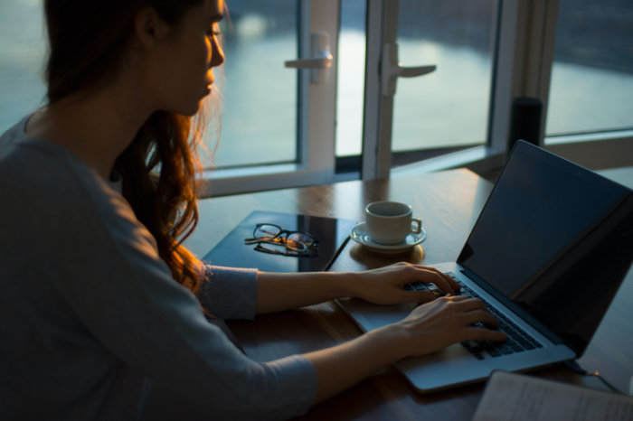 Woman typing laptop